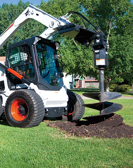 Bobcat Wheel Skid Steer with Auger Post Hole Digger Attachment